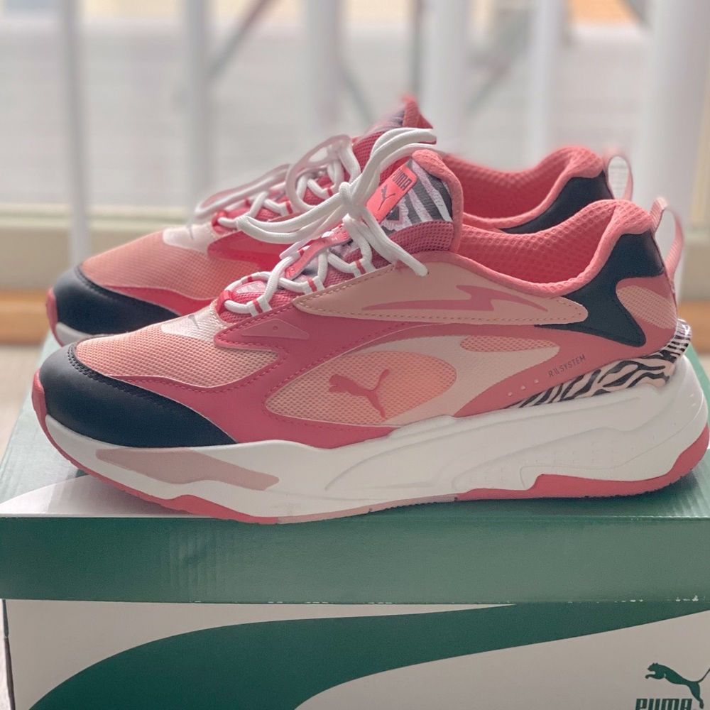 - Pink Puma sneakers with zebra print detail